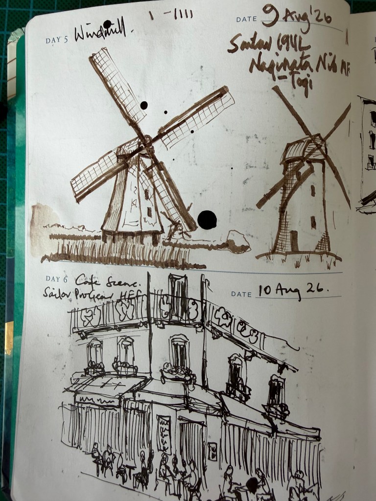Sketchbook page showing Day 5 windmill and Day 6 street café ink sketches.